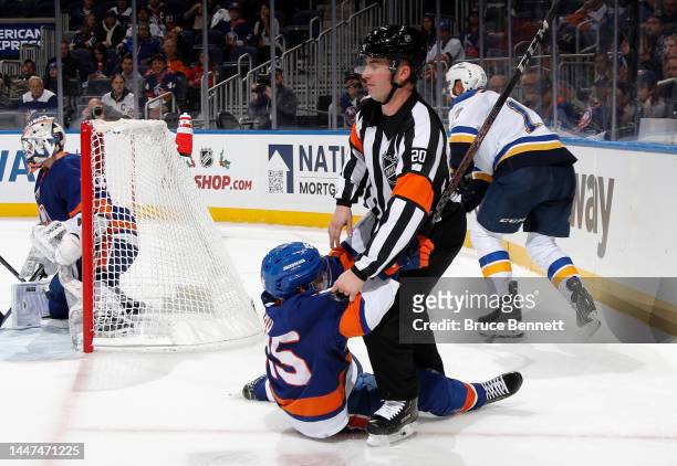 Sebastian Aho of the New York Islanders runs into referee Mitch Dunning during the game against the St. Louis Blues at the UBS Arena on December 06,...