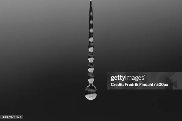 close-up of water drop against black background,sweden - vätska stock pictures, royalty-free photos & images