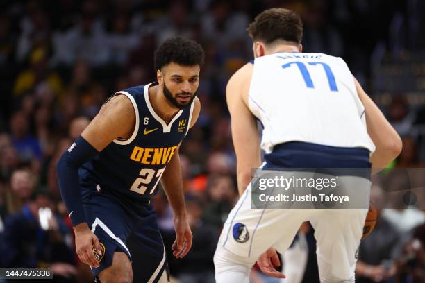 Jamal Murray of the Denver Nuggets defends Luka Doncic of the Dallas Mavericks in the second half at Ball Arena on December 6, 2022 in Denver,...