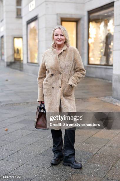 German TV presenter Ulla Kock am Brink wearing a beige reversible teddy coat by Nove, black pants by Zadig & Voltaire, a dark brown bag with metal...