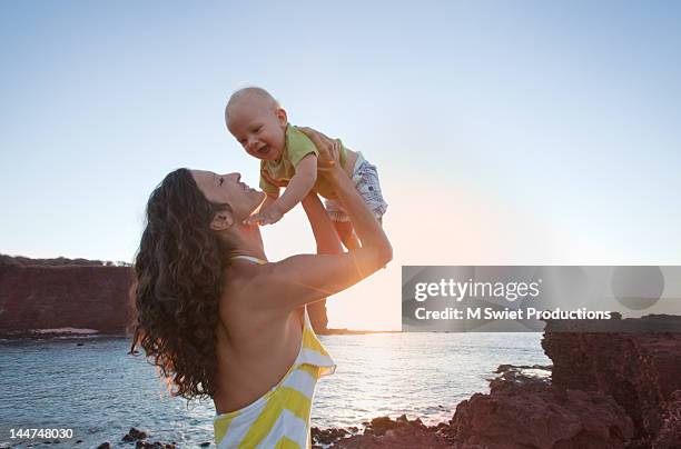 mother and child - backless dress stock pictures, royalty-free photos & images