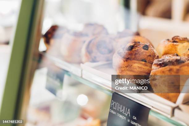 pasties on a display case at the bakery - boulangerie vitrine stock pictures, royalty-free photos & images