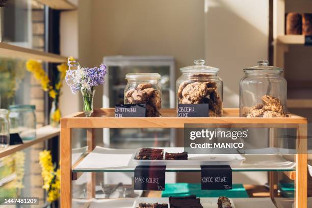 sweet pasties in bakery - boulangerie vitrine stock pictures, royalty-free photos & images