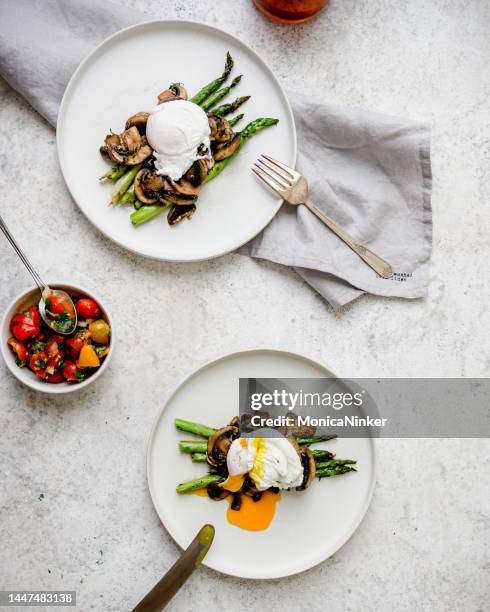 poached eggs on toast with avocado, asparagus, tomatoes and sprout for healthy breakfast - frittata stock pictures, royalty-free photos & images