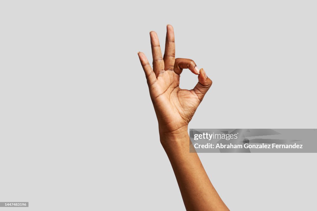Background of an African hand gesturing to be okay