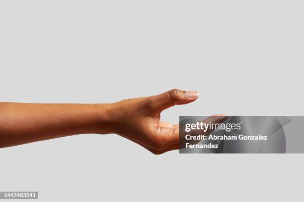 african hand gesturing waiting for something to be given to it. - human hand isolated stock pictures, royalty-free photos & images