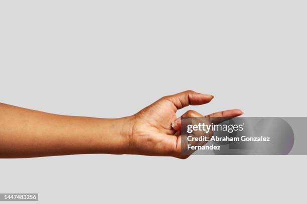 african hand pointing in front of it - finger stockfoto's en -beelden