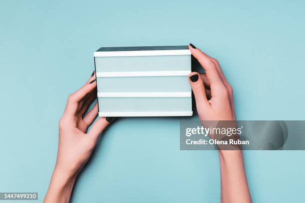 white board in woman hands - chalkboard eraser stock pictures, royalty-free photos & images