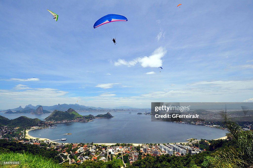 Man with parachute in air