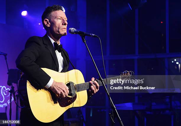 Lyle Lovett performs during the Haiti Carnival in Cannes Benefitting J/P HRO, Artists for Peace and Justice & Happy Hearts Fund Presented By Armani...