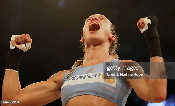 German kickboxer Christine Theiss celebrates after winning against against Ania Fucz of Germany after the WKA middleweight world title fight at...