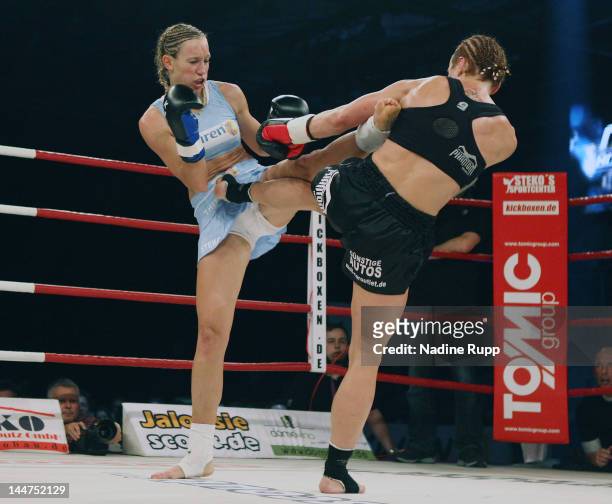 German kickboxer Christine Theiss fights against Ania Fucz of Germany during the WKA middleweight world title fight at Olympia Eishalle on May 18,...