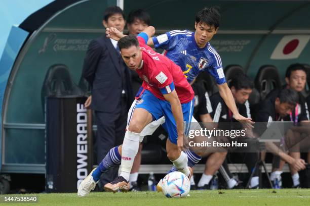 Bryan Oviedo of Costa Rica in action under pressure from Miki Yamane of Japan during the FIFA World Cup Qatar 2022 Group E match between Japan and...