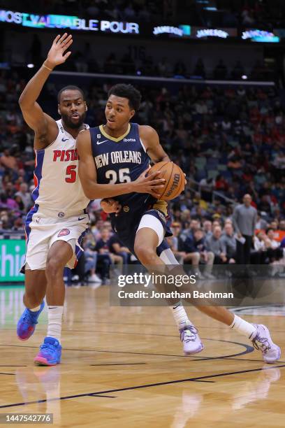 Trey Murphy III of the New Orleans Pelicans drives against Alec Burks of the Detroit Pistons during the first half at the Smoothie King Center on...