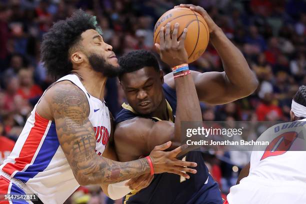 Zion Williamson of the New Orleans Pelicans drives against Saddiq Bey of the Detroit Pistons during the first half at the Smoothie King Center on...