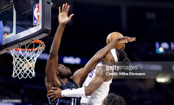 Terance Mann of the LA Clippers is fouled by Mo Bamba of the Orlando Magic during a game at Amway Center on December 07, 2022 in Orlando, Florida....