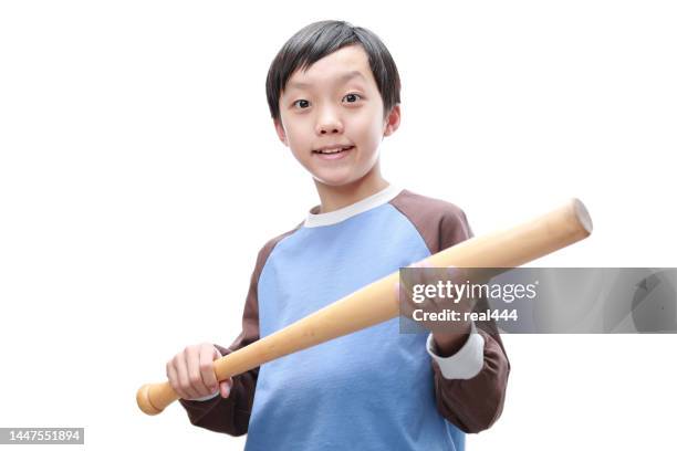 joyful little boy posing with a baseball bat - bat stockfoto's en -beelden