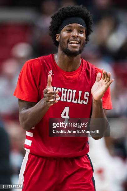 Guard Caleb Huffman of the Nicholls Colonels claps after making a shot during the first half against the Texas Tech Red Raiders at United...