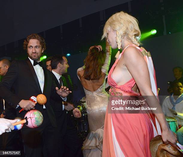 Actor Gerard Butler and guest attend the Haiti Carnival in Cannes Benefitting J/P HRO, Artists for Peace and Justice & Happy Hearts Fund Presented By...