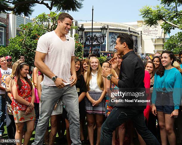 Kris Humphries and Mario Lopez visit "Extra" at The Grove on May 18, 2012 in Los Angeles, California.