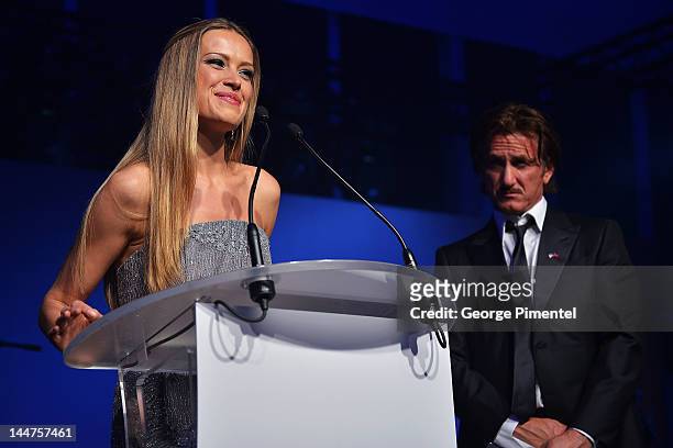 Petra Nemcova and Sean Penn speak onstage at the Haiti Carnival in Cannes Benefitting J/P HRO, Artists for Peace and Justice & Happy Hearts Fund...