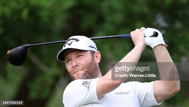 Branden Grace of South Africa tees off on the 11th hole during Day One of the Alfred Dunhill Championship at Leopard Creek Country Club on December...