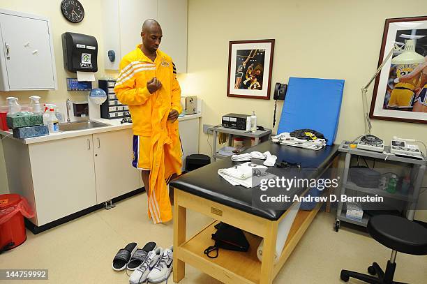 Kobe Bryant of the Los Angeles Lakers prepares himself in the training room before a game against the Oklahoma City Thunder in Game Three of the...