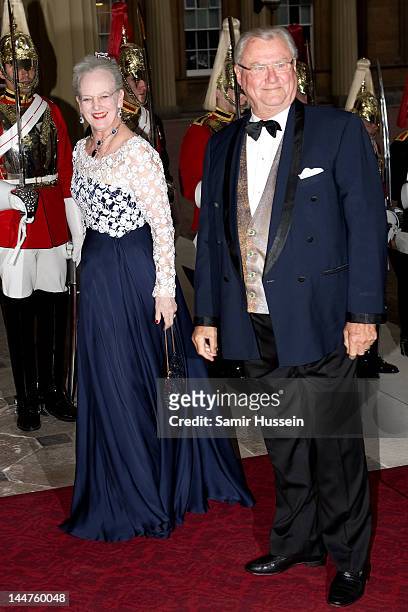 Queen Margarethe II of Denmark and Prince Henrik of Denmark attend a dinner for foreign Sovereigns to commemorate the Diamond Jubilee at Buckingham...