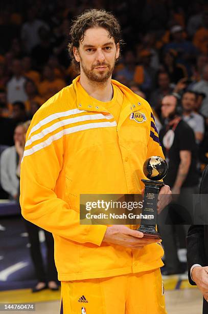 Pau Gasol of the Los Angeles Lakers receives the J. Walter Kennedy citizenship award before a game against the Oklahoma City Thunder in Game Three of...