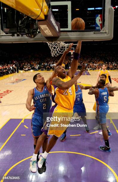 Kobe Bryant of the Los Angeles Lakers shoots over Thabo Sefolosha of the Oklahoma City Thunder in Game Three of the Western Conference Semifinals in...