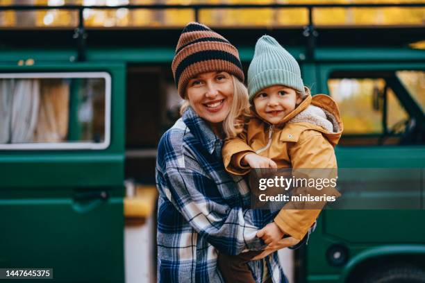 portrait of a happy mother with her child in the forest - portrait of a camper stock pictures, royalty-free photos & images