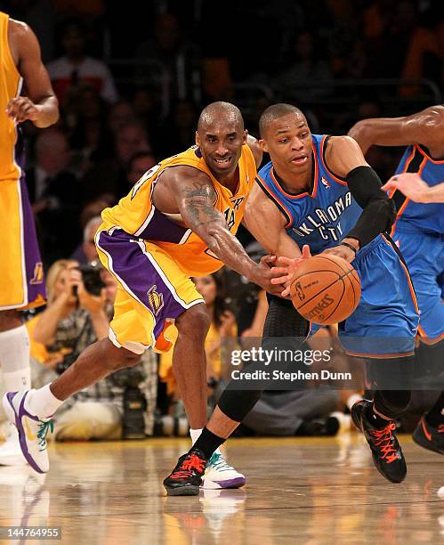 Russell Westbrook of the Oklahoma City Thunder steals the ball from Kobe Bryant of the Los Angeles Lakers in Game Three of the Western Conference...