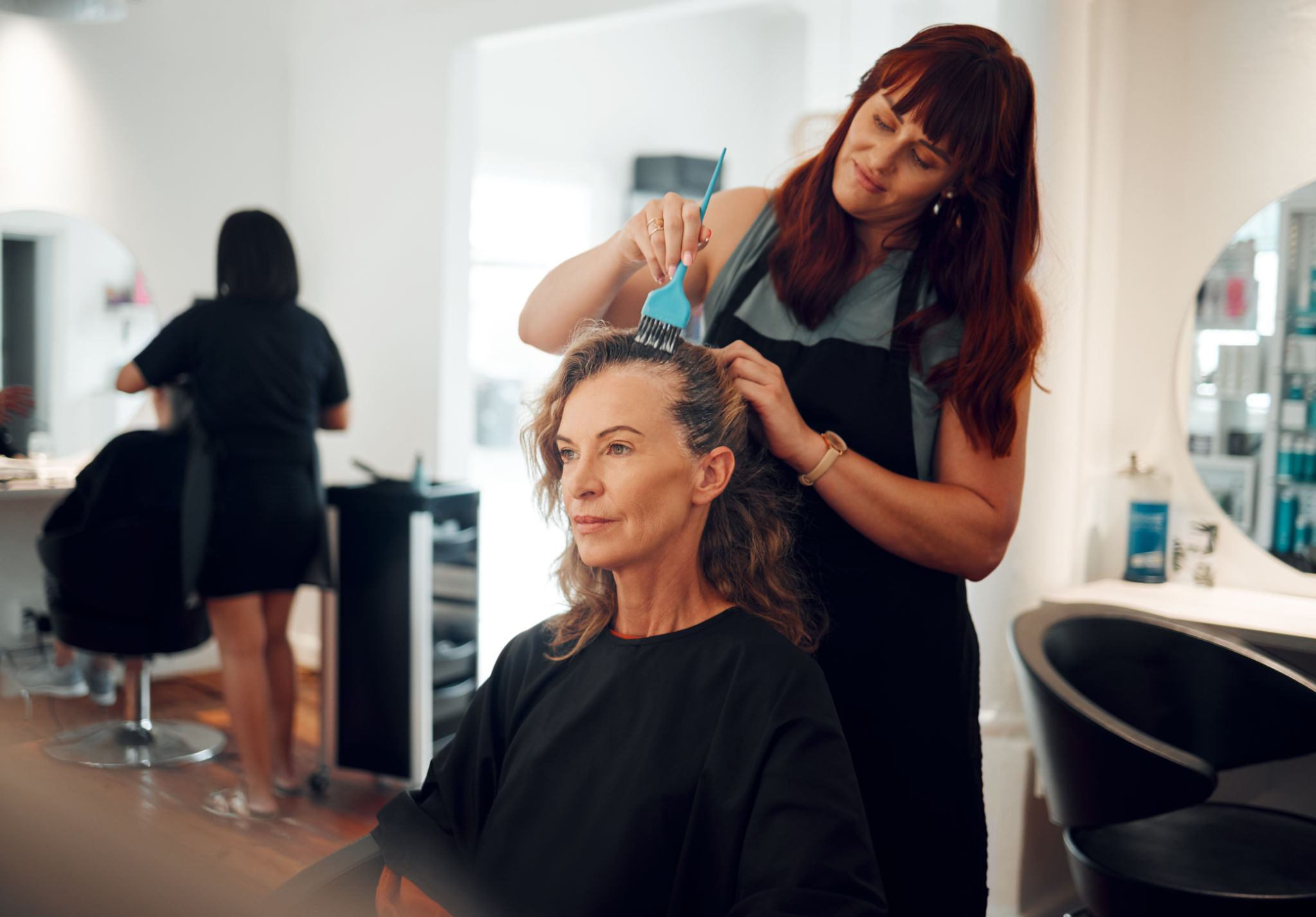stylist applying color