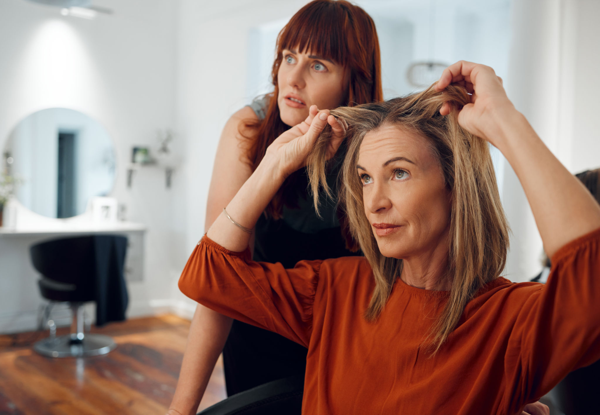woman choosing hairstyle