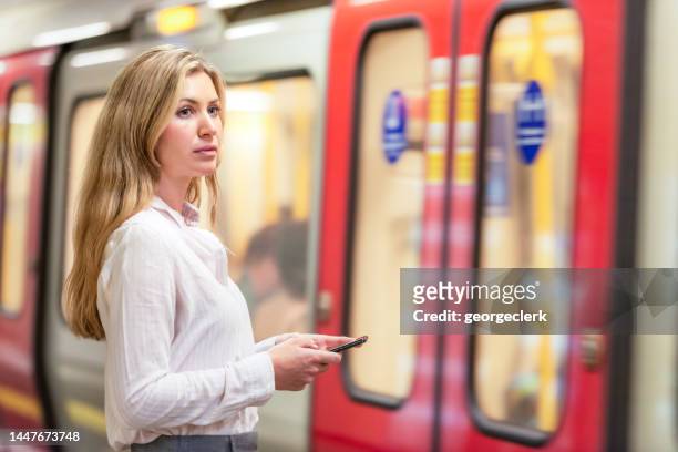 london business commuter - london underground train stock pictures, royalty-free photos & images