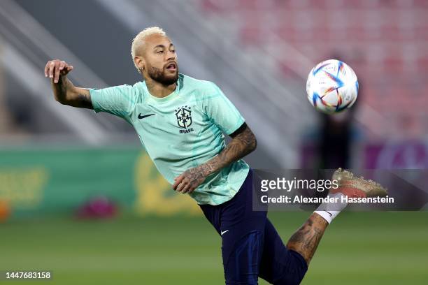 Neymar of Brazil plays the ball during a training session on match day -1 at Al Arabi SC Stadium on December 08, 2022 in Doha, Qatar.