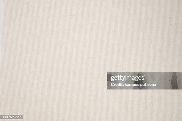 close up of a white textured canvas background - pergament stock-fotos und bilder