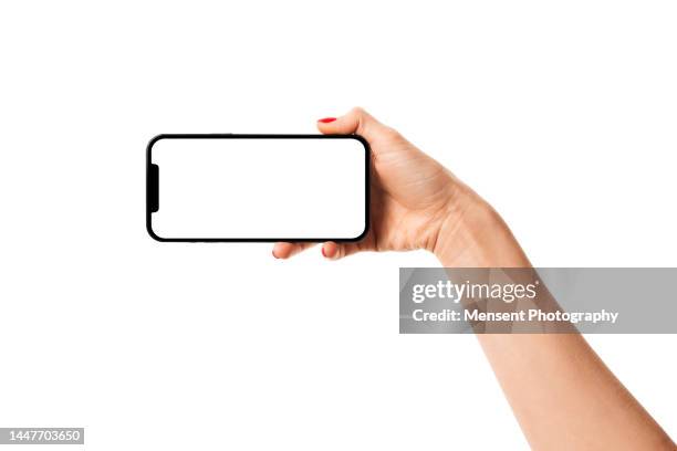 hand holding  smartphone phone iphone mockup with white screen on white background - telefonhörer freisteller stock-fotos und bilder