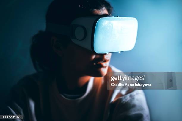 modern african american woman is using vr glasses to access metaverse world - smart glasses eyewear foto e immagini stock