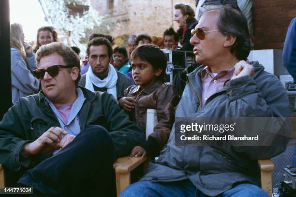 Producer Jeremy Thomas and cinematographer Vittorio Storaro on the set of the film 'Little Buddha', circa 1992. Between them is child actor Raju Lal,...