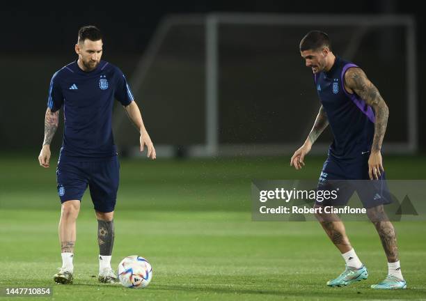 Lionel Messi and Rodrigo De Paul of Argentina are seen during a training session on match day -1 at Qatar University on December 08, 2022 in Doha,...