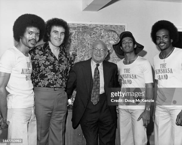 English singer Johnny Wakelin with members of the Kinshasa Band and boxing promoter Jack Solomons , UK, November 1974. Wakelin has just recorded a...