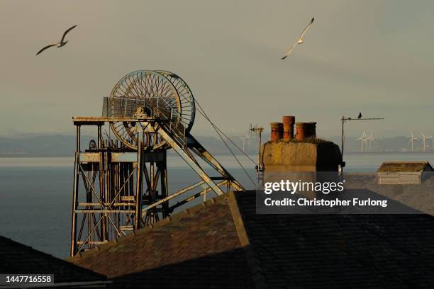 The winding wheel of Haig Colliery Mining Museum adjacent to the West Cumbria Mining offices who been given approval to once again extract coal on...