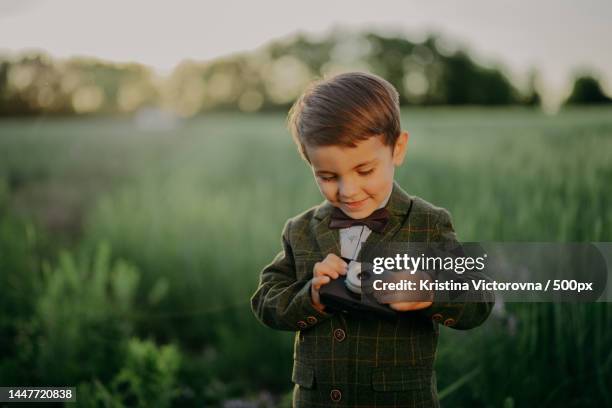 handsome little boy with vintage retro camera kid as young - lomo camera stock pictures, royalty-free photos & images