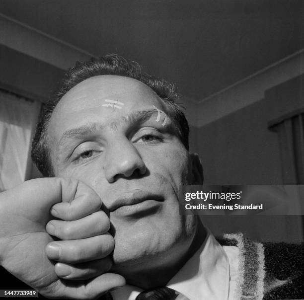 British boxer Henry Cooper pictured the day after a fight with American boxer Zora Folley at Wembley Empire Pool in London, on December 6th, 1961.