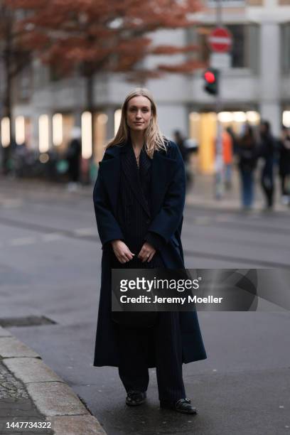 Model and Content Creator Marlies Pia Pfeifhofer wearing LeGer by Lena Gercke navy blue pinstriped suit, navy blue long wool coat, Laura Lombardi...