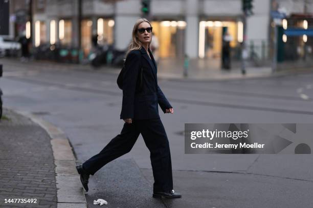 Model and Content Creator Marlies Pia Pfeifhofer wearing LeGer by Lena Gercke navy blue pinstriped suit, Ray-Ban black sunglasses, Givenchy black...