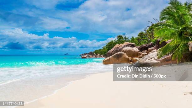 scenic view of beach against sky,indonesia - tropical island stock pictures, royalty-free photos & images