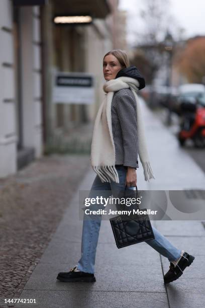 Model und Content Creator Marlies Pia Pfeifhofer wearing Dior black/white checked blazer jacket, Dior black hooded gilet, Agolde Criss Cross blue...