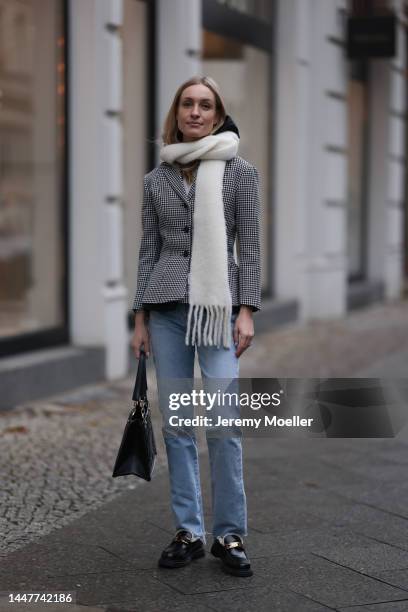 Model und Content Creator Marlies Pia Pfeifhofer wearing Dior black/white checked blazer jacket, Dior black hooded gilet, Agolde Criss Cross blue...